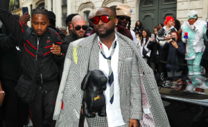 Davido at Paris Fashion Week wearing Thom Browne