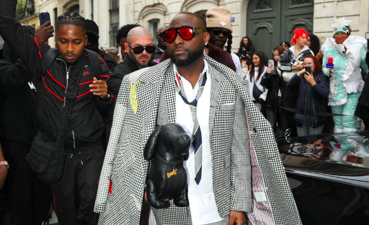 Davido at Paris Fashion Week wearing Thom Browne