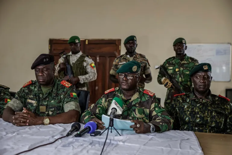 Brigadier General Denis N'Canha, head of the military office of the Guinea-Bissau presidency, announces the government takeover on November 26, 2025 [Patrick Meinhardt/AFP]