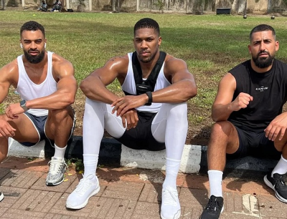 British former heavyweight boxer Anthony Joshua pictured with close friends Latif "Latz" Ayodele & Sina Ghami.
